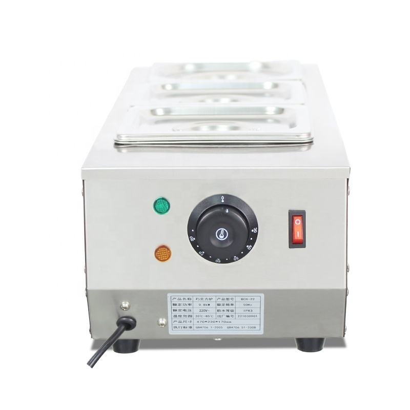 Close-up of the chocolate warmer control panel with power, heat and temperature knob
