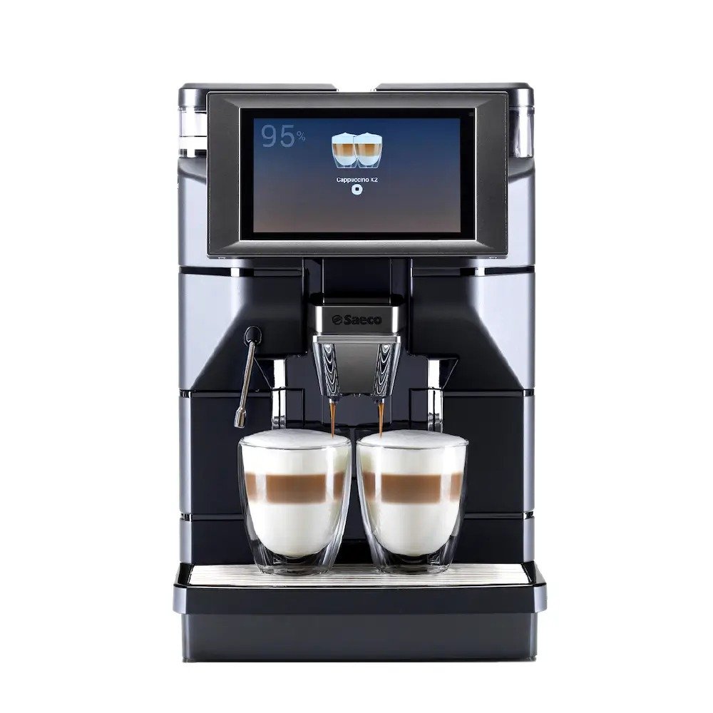 Saeco Magic M1 coffee machine brewing an espresso in a café setting